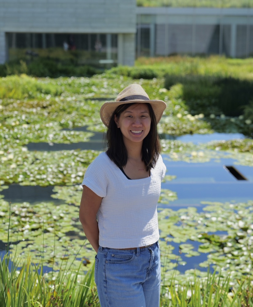 Portrait beside a lily pond